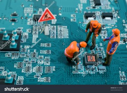 stock-photo-miniature-engineers-fixing-error-on-chip-of-motherboard-computer-repair-concept-close-up-view-90123031